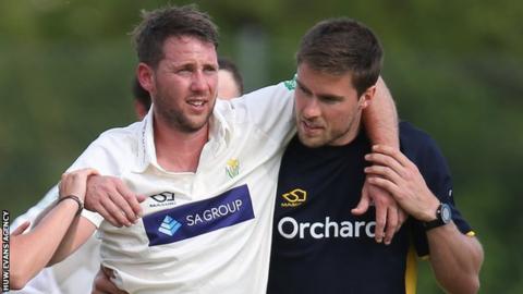 Chris Cooke is helped off against Gloucestershire in May, 2019