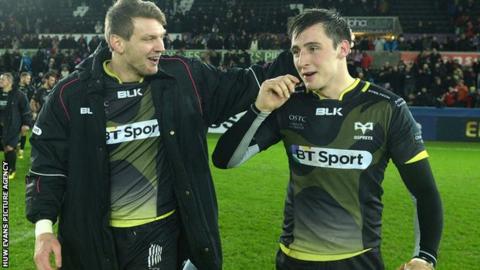Dan Biggar (left) congratulates match-winner Sam Davies