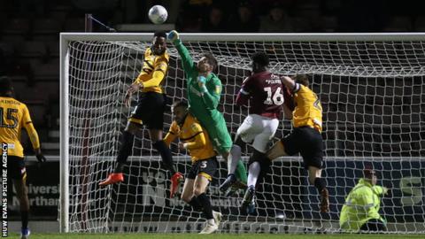 Joe Day saves a shot on goal