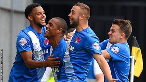 Jay Simpson celebrates scoring with his Leyton Orient team-mates