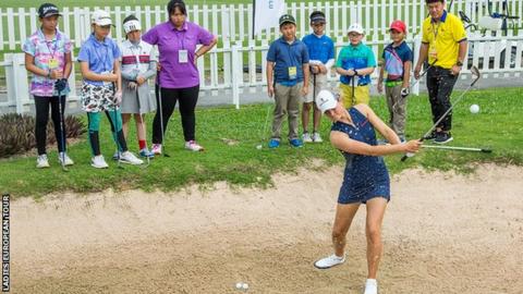 Annabel Dimmock playing out of a bunker