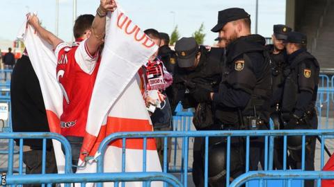 Arsenal fans being spoken to in Madrid by local police