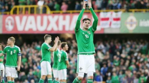 Northern Ireland striker Kyle Lafferty applauds the home support at Windsor Park