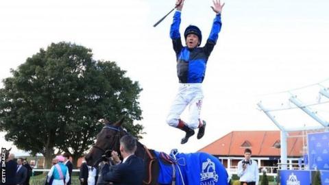 Frankie Dettori celebrates after winning at Newmarket