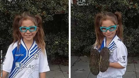 Seven-year-old Darcy in her football kit