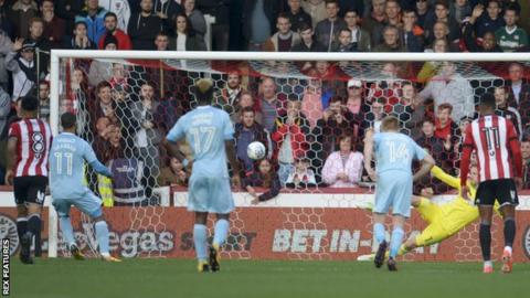 Lewis Grabban scores a penalty against Brentford