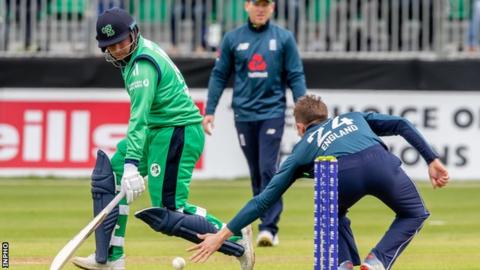 Gary Wilson scampers in to deny England's Joe Denly in the ODI at Malahide in 2019