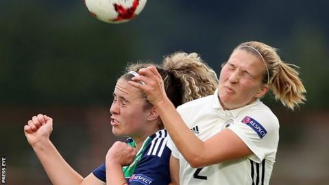 Brenna McPartlan of Northern Ireland competes with Germany's Dina Orschmann