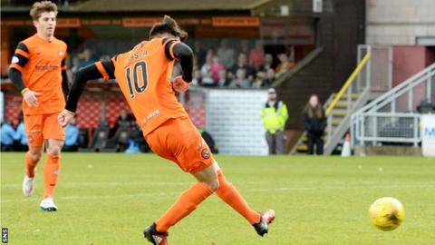 Scott Fraser slots home the equaliser for Dundee United