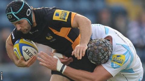 Chris Bell is tackled by Worcester full-back Chris Pennell