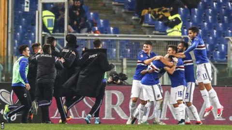 Sampdoria's players celebrate scoring at Roma