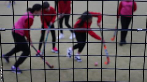 Children playing hockey