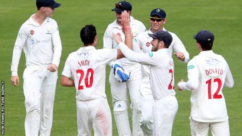 Glamorgan celebrate the one Gloucestershire wicket to fall on day two