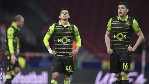 Sporting Lisbon players look dejected after defeat by Atletico Madrid
