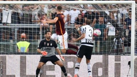 Edin Dzeko scores