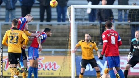 Joe Worrall scores Dagenham's second goal against Newport