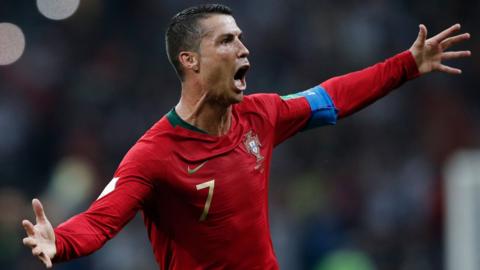 Cristiano Ronaldo celebrates scoring Portugal's third goal against Spain