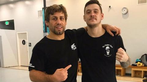 Scott Malone, right, with UFC Hall of Fame fighter Urijah Faber in California