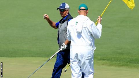 Sandy Lyle salutes the crowd after making a birdie at the second hole