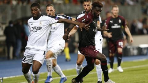 Dudelange's Stelvio da Cruz challenges Milan's Tiemoue Bakayoko