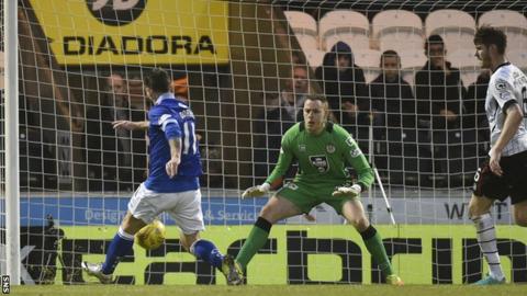 Stephen Dobbie steals in to score his 17th goal of the season