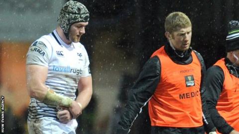 Dan Lydiate is substituted clutching his arm during the Ospreys' game against the Dragons
