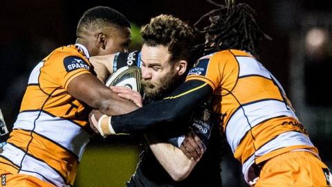 Glasgow Warriors' Ruaridh Jackson is held up by two Cheetahs players