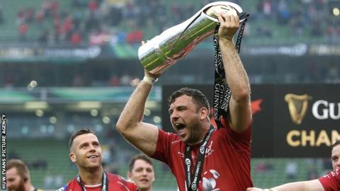 Tadgh Beirne celebrates with the Pro12 trophy after Scarlets' win over Munster in the 2016-17 final