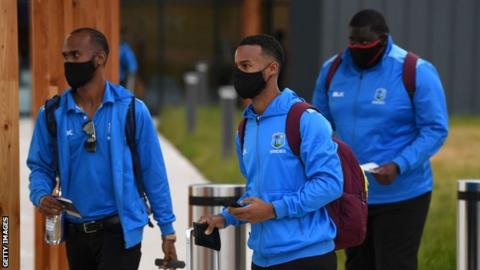 West Indies players Kraigg Brathwaite (left), Shai Hope (centre) and Rakheem Cornwall (right) arrive at Manchester Aiport wearing face masks before their Test tour of England