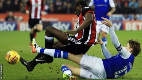 Glenn Loovens tackles Clayton Donaldson