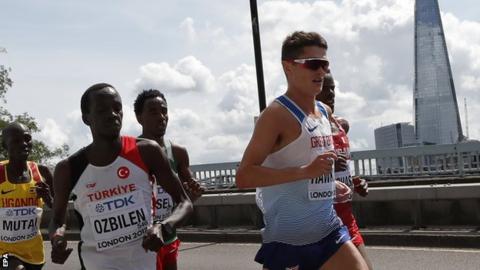 Callum Hawkins (right) leads the pack in the marathon at the World Championships