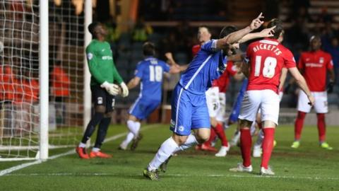 Michael Bostwick's late first-half headed opener put Posh on the way to victory at London Road