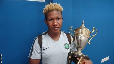 Nigeria captain Rita Chikwelu with Women's Africa Cup of Nations trophy
