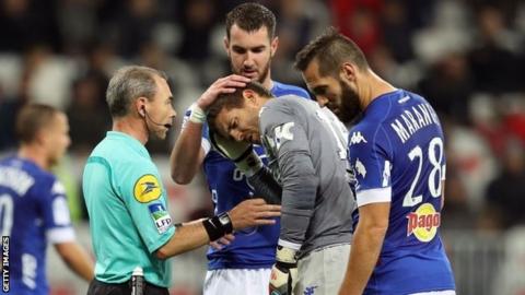 Jean-Louis Leca holds head