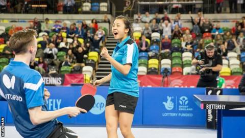 Tin-Tin Ho (right) and Liam Pitchford celebrate winning the mixed doubles title