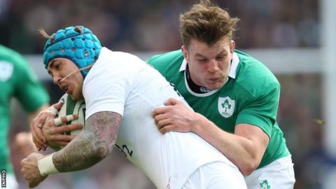 Jordi Murphy tackles England's Jack Nowell in the March 2015 game in Dublin