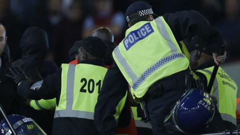 Riot police and stewards at West Ham v Chelsea