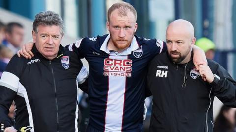 Ross County's Liam Boyce is helped off against St Johnstone