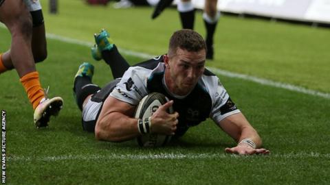 George North of Ospreys dives in to score a try