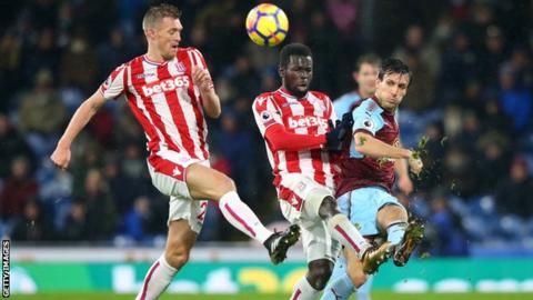 Jack Cork of Burnley and Darren Fletcher and Mame Biram Diouf of Stoke