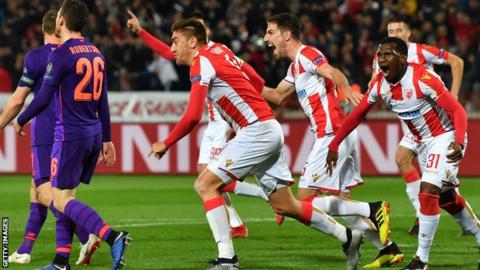 Red Star Belgrade fans celebrate scoring against Liverpool