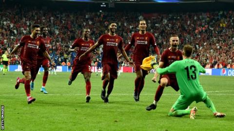 Liverpool players celebrating with Adrian