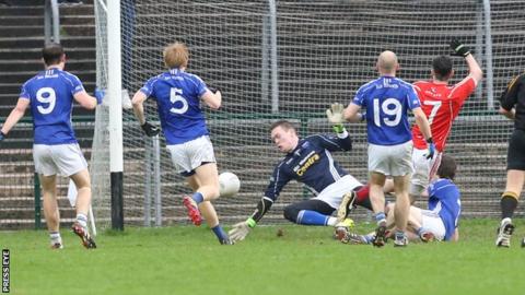 Trillick's Daniel NcDonnell scores the opening goal at Brewster Park