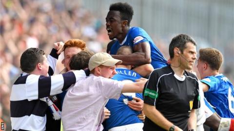 Rangers fans spill onto the pitch to celebrate with players after their injury-time winner against Partick