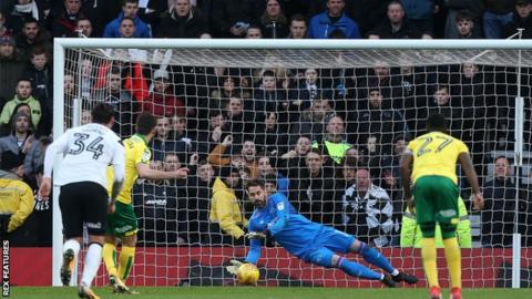 Derby County goalkeeper Scott Carson saves Nelson Oliveira's first-half penalty