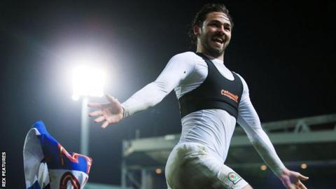 Bradley Dack throws off his shirt after scoring Blackburn's third goal against Peterborough