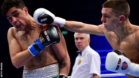 Pat McCormack throws a punch at Raul Curiel
