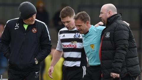 Referee Crawford Allan is taken off injured