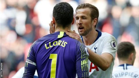 Harry Kane congratulates Spurs keeper Hugo Lloris after he saved a penalty in the 1-1 draw with Arsenal