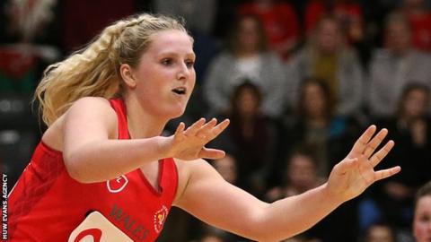 Chelsea Lewis passes the ball